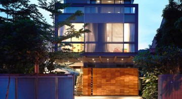 detached modern house front facade at night