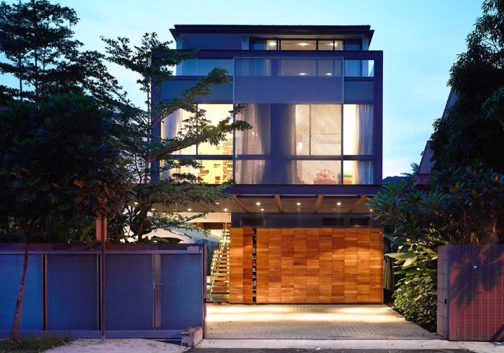 detached modern house front facade at night