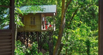 half hidden treehouse on stilts