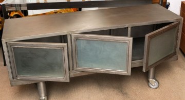 metal credenza with three swing doors and mash panel