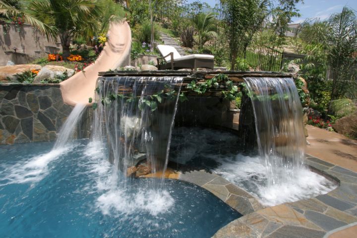 pool waterfall ideas with large stone