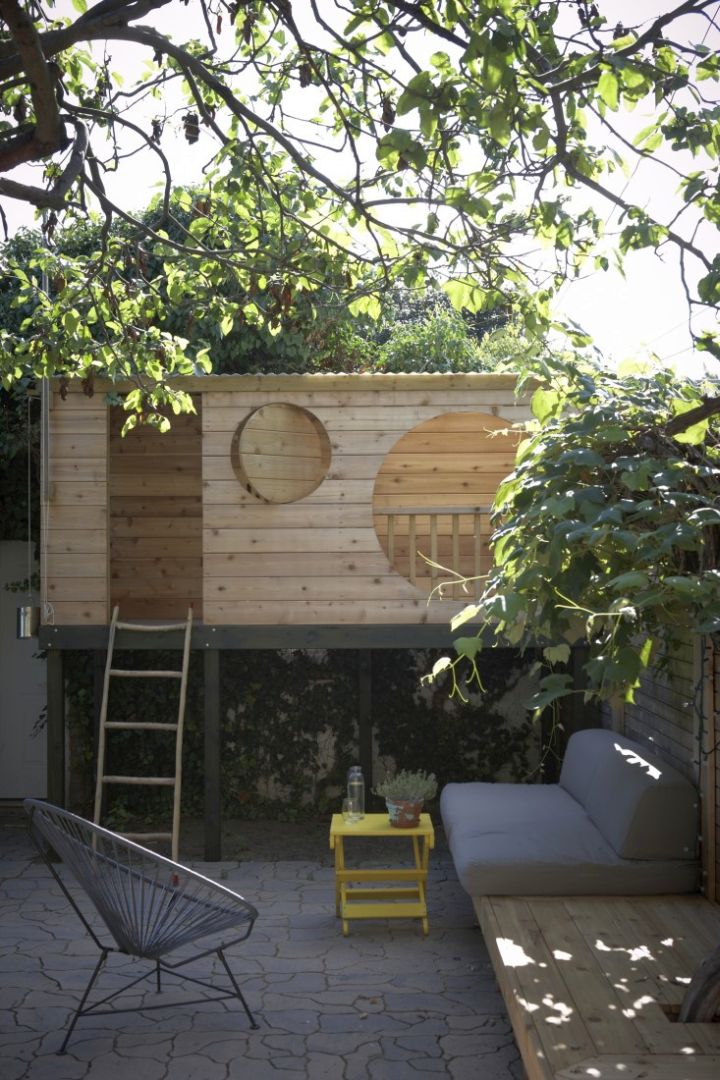 small contemporary treehouse on stilts