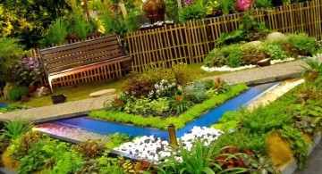 terraced flower garden with small pond and garden chair