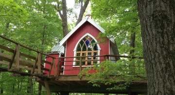 treehouse on stilts in red