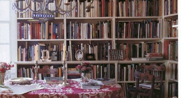 bohemian chandelier with bookshelves in dining room