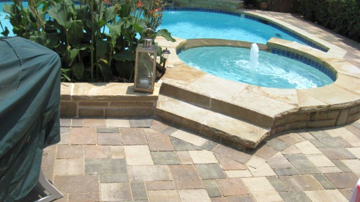 bright colored brick paved pool deck stone