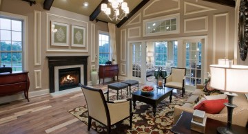 cathedral ceiling living room in black and white with fireplace and chandelier