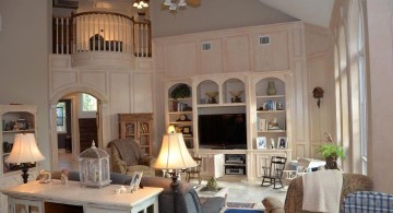 cathedral ceiling living room with indoor balcony