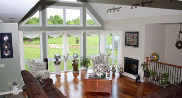 cathedral ceiling living room with large french windows