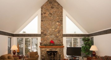 cathedral ceiling living room with receased lighting