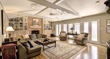 cathedral ceiling living room with wooden floor and crossed beams