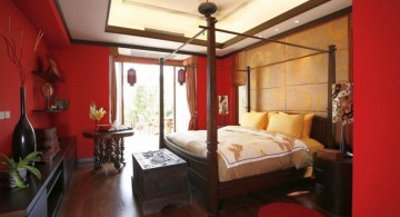 modern asian bedroom with canopied bed and red walls