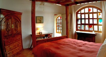 modern asian bedroom with four posts bed and rustic closet