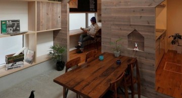 rustic bookshelves in dining room with wooden walls