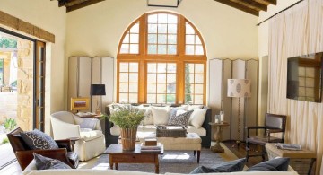 tuscan living room designs with cathedral ceiling and unique chandelier
