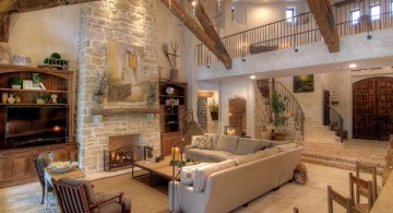 tuscan living room designs with criss crossed beams and stone fireplace