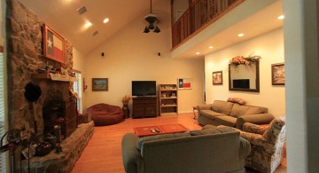 warm and cozy cathedral ceiling living room with fireplace