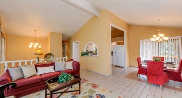 warm cathedral ceiling living room shared with dining room