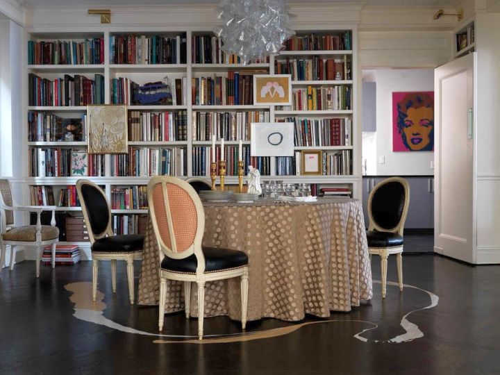 whole wall bookshelves in dining room